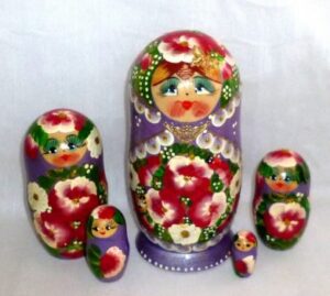 Ksenia in floral purple dress Babushka Matryoshka nesting Doll Babooshki Babushkas