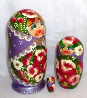 Ksenia in floral purple dress nesting Doll Babooshki s