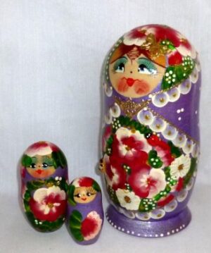 Ksenia in floral purple dress nesting Doll Babooshki s