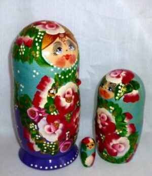 Ksenia in floral blue dress nesting Doll Babooshki s