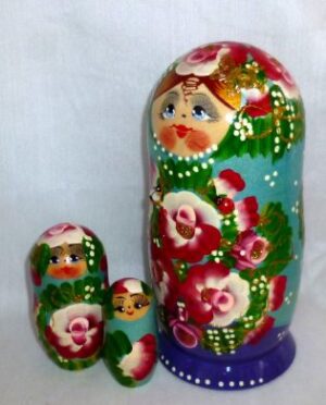 Ksenia in floral blue dress nesting Doll Babooshki s