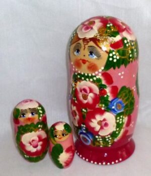 Ksenia in floral red dress nesting Doll Babooshki s