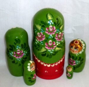 Shura in floral green dress nesting Doll Babooshki s