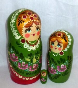 Shura in floral green dress nesting Doll Babooshki s