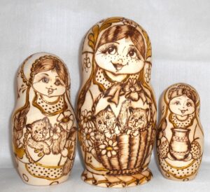 Anfisa with gold leaves and kittens in basket nesting Doll Babooshki s
