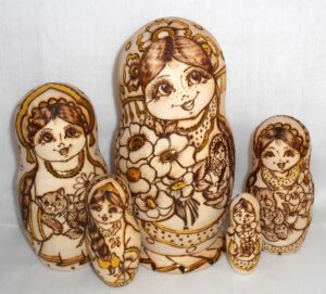 Anfisa with bunch of flowers and babushka doll Babushka Matryoshka nesting Doll Babooshki Babushkas