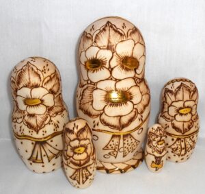 Anfisa with bunch of flowers and doll nesting Doll Babooshki s
