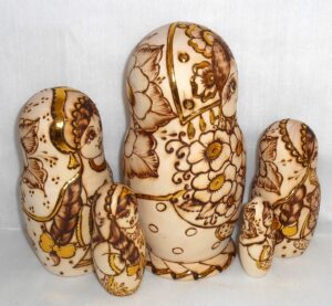 Anfisa with bunch of flowers and doll nesting Doll Babooshki s