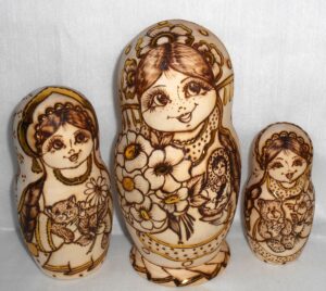 Anfisa with bunch of flowers and doll nesting Doll Babooshki s