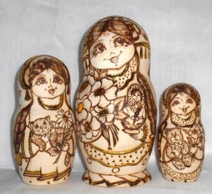 Anfisa with bunch of flowers and doll nesting Doll Babooshki s