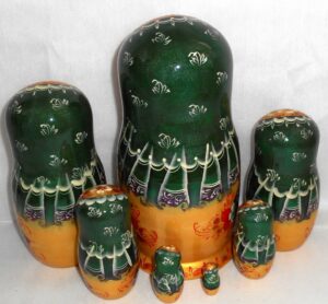 Stella Golden girl in green scarf 7-set nesting Doll Babooshki s