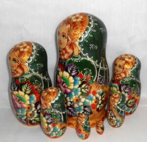 Stella Golden girl in green scarf 7-set nesting Doll Babooshki s