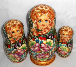 Stella Golden girl in green scarf 7-set nesting Doll Babooshki s