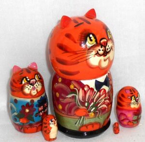 Funny orange cat with bunch of flowers small nesting Doll Babooshki s