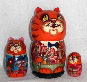 Funny orange cat with bunch of flowers small nesting Doll Babooshki s