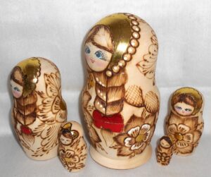 Girl with plait & red bow nesting Doll Babooshki s
