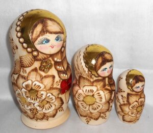 Girl with plait & red bow nesting Doll Babooshki s