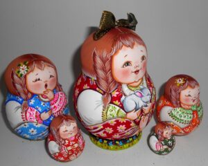 Village girl in red Matty with rabbit gold bow nesting Doll Babooshki s