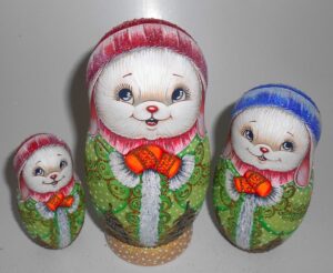 Rabbit in green coat nesting Doll Babooshki s