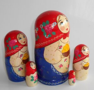 Marusya with yellow apples in red and blue nesting Doll Babooshki s