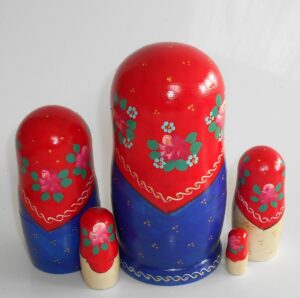 Marusya with yellow apples in red and blue nesting Doll Babooshki s