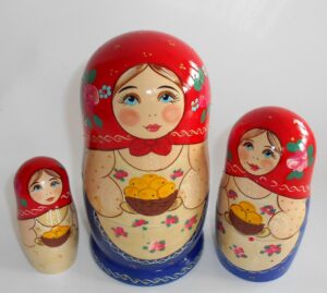 Marusya with yellow apples in red and blue nesting Doll Babooshki s