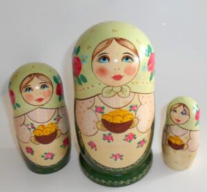 Marusya with yellow apples in green dress nesting Doll Babooshki s