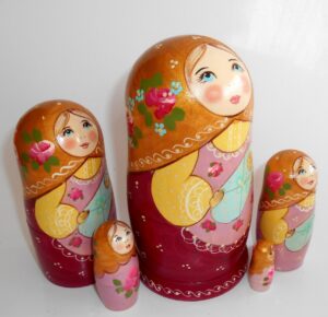 Marusya with baby in gold scarf nesting Doll Babooshki s