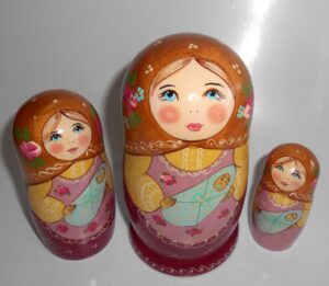Marusya with baby in gold scarf nesting Doll Babooshki s