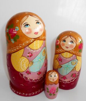 Marusya with baby in gold scarf nesting Doll Babooshki s