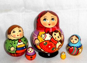 Village girl with self-made doll red scarf Babushka Matryoshka nesting Doll Babooshki Babushkas Classic Village Traditional