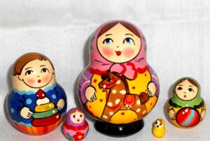 Village girl with rocking horse pink scarf Babushka Matryoshka nesting Doll Babooshki Babushkas Classic Village Traditional