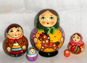 Village girl with rocking horse green scarf Babushka Matryoshka nesting Doll Babooshki Babushkas Classic Village Traditional