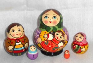 Village girl with self-made doll green scarf Babushka Matryoshka nesting Doll Babooshki Babushkas Classic Village Traditional