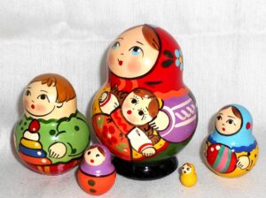 Village girl with self-made doll green dress red scarf nesting Doll Babooshki s Classic Village Traditional
