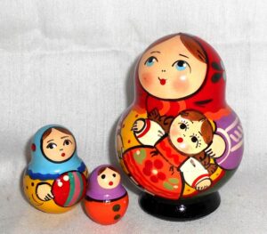 Village girl with self-made doll green dress red scarf nesting Doll Babooshki s Classic Village Traditional