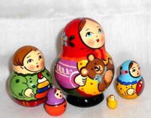 Village girl with teddy bear green dress red scarf nesting Doll Babooshki s Classic Village Traditional