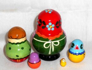 Village girl with teddy bear green dress red scarf nesting Doll Babooshki s Classic Village Traditional