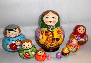 Village girl with rocking horse green scarf 10-set Babushka Matryoshka nesting Doll Babooshki Babushkas Classic Village Traditional