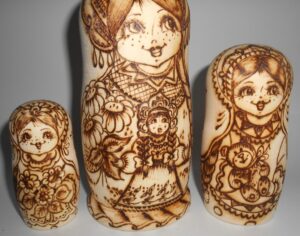 Village girls with toys nesting Doll Babooshki s