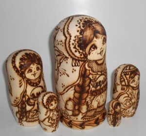 Village girls with Easter pies and eggs nesting Doll Babooshki s