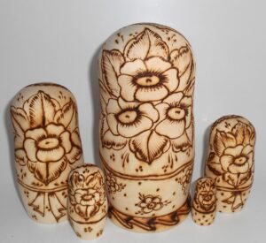 Village girls with Easter pies and eggs nesting Doll Babooshki s