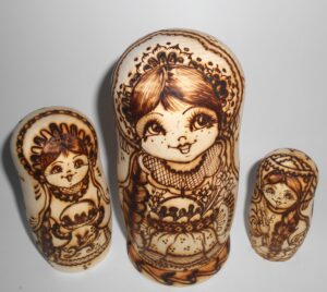 Village girls with Easter pies and eggs nesting Doll Babooshki s