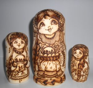 Village girls with Easter pies and eggs nesting Doll Babooshki s