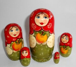 Kira in green dress with apple II small Babushka Matryoshka nesting Doll Babooshki Babushkas