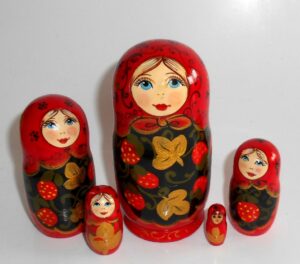 Kira in black apron with strawberries small Babushka Matryoshka nesting Doll Babooshki Babushkas