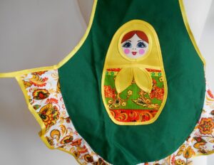 Kids Apron green and colourful nesting Doll Babooshki s