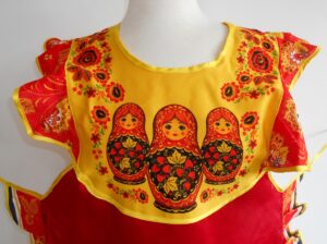 Apron red and yellow with pocket and collar ‘Three s’ nesting Doll Babooshki s
