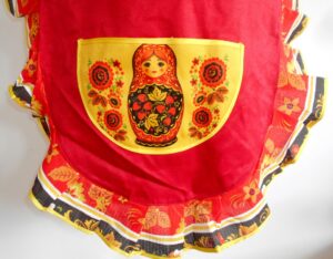 Apron red and yellow with pocket and collar ‘Three s’ nesting Doll Babooshki s