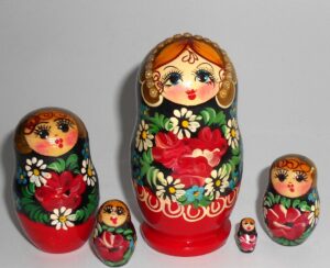 Girl in red & black floral dress Babushka Matryoshka nesting Doll Babooshki Babushkas